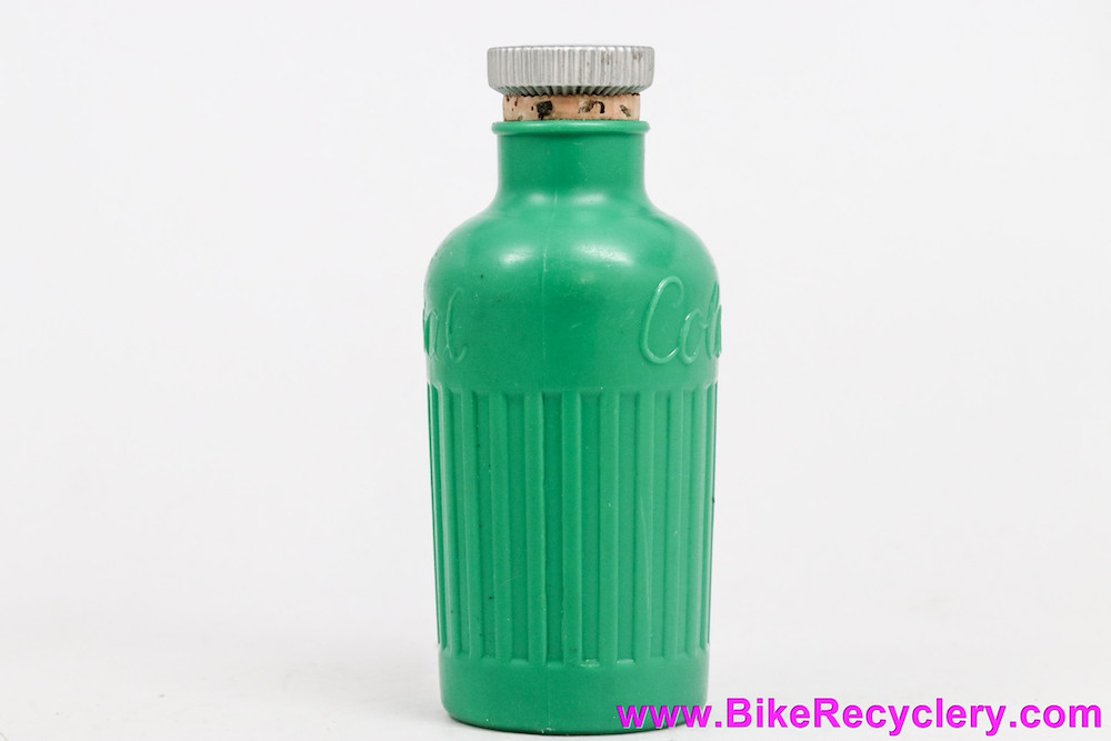 An early plastic water bottle, complete with cork top