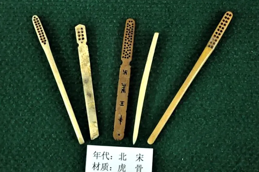 An image of a collection of tiger-bone toothbrushes from 10th century china
