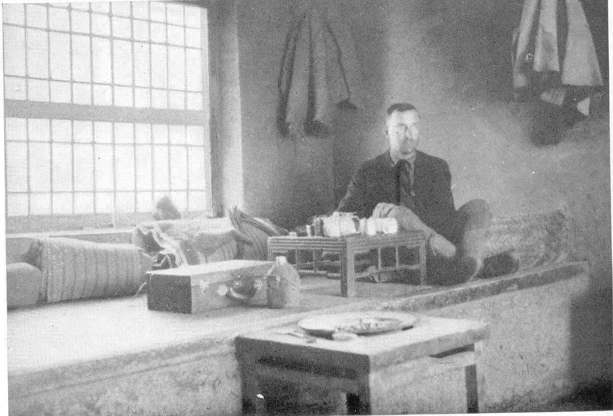 Author Harry A. Franck sitting on a Kang in 1923